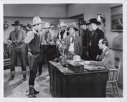 Roy Rogers holds his hands up men point guns at him 8x10 inch photo ...