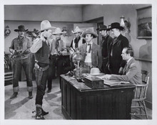 Roy Rogers holds his hands up men point guns at him 8x10 inch photo