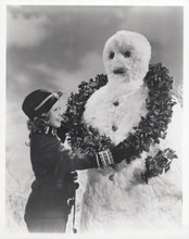 Shirley Temple puts Christmas wreath around Snowman 8x10 inch photo