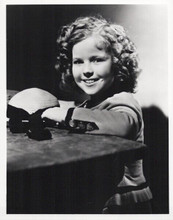 Shirley Temple smiling pose seated at table 8x10 inch photo