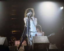 Steve Tyler on stage holding microphone 1970's era 8x10 inch photo