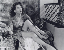 Yvonne De Carlo paints her toe nails sitting on bed leggy pose 8x10 photo
