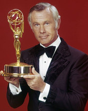 Johnny Carson in tuxedo holding Emmy Award statue 8x10 inch photo