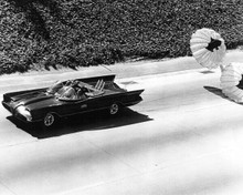 Batman 1966 TV series Batmobile on road with parachutes behind it 8x10 photo