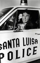 Burt Reynolds in Santa Luisa Police squad car 1970 Dan August 8x10 inch photo
