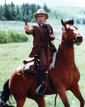 Sam Elliott in suit on horseback ready for gun action 8x10 inch photo
