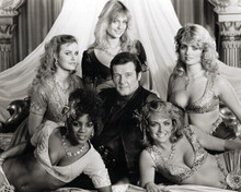 Octopussy Roger Moore poses with Bond girls 8x10 inch photo