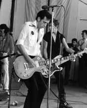 The Clash Mick Jones & Joe Strummer play their guitars in concert 8x10 photo