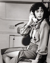 Sylvia Kristel sits by airplane door on phone Airport '80 Concorde 8x10 photo