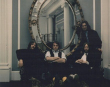 The Beatles vintage 8x10 inch photo circa 1970 seated on sofa by mirror