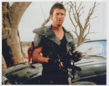 Mel Gibson classic pose as Mad Max by his vehicle vintage 8x10 inch photo