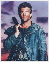 Mel Gibson holds up gun as Mad Max Road Warrior vintage 8x10 inch photo