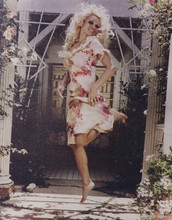 Pamela Anderson 1990's pose jumps in air in pink dress vintage 8x10 inch photo