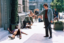 Dirty Harry Clint Eastwood aims his 44' Magnum toward man on sidewalk 8x10 photo