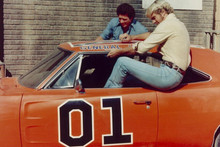 Dukes of Hazzard John Schneider Tom Wopat jump into General Lee 8x10 inch photo