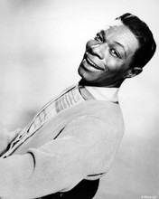 Nat King Cole in casual attire leans back on chair smiling 8x10 inch photo