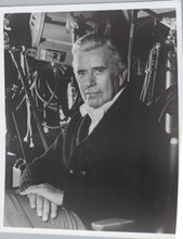 John Forsythe poses next to camera on Dynasty TV show set 8x10 inch photo