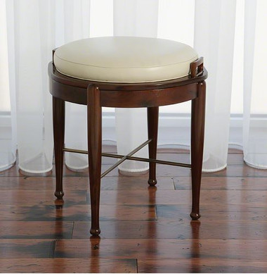 Dual function stool, this walnut finish stool with metal crossbase has a top that is removable and will flip to reveal a ivory leather cushion for extra seating or a smooth table top.