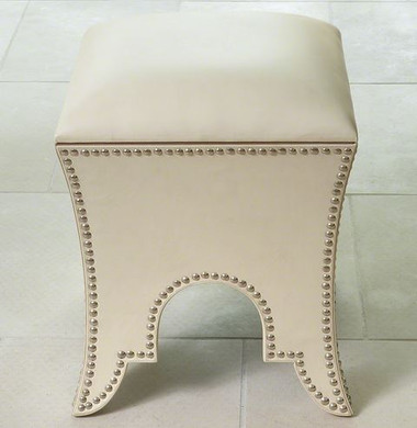 A white leather moroccan pouf from Global Views