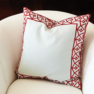 The bezel border pattern is inspired by an antique air vent register. Realized in an embroidered pattern in a contrasting color around a cotton pillow. Pattern on front and back