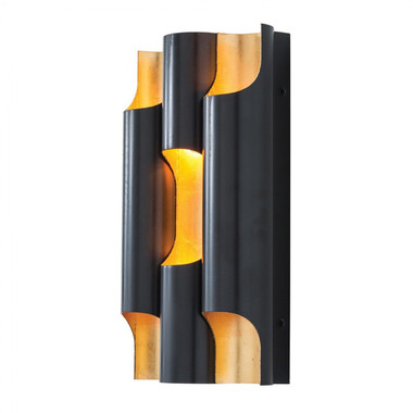 In the Wolfe Sconce, steel is transformed with two paradoxical finishes. While a masculine bronze finish covers the outside, a more delicate gold leaf is applied on the inside to better reflect light and create an impactful visual contrast. This sconce is damp rated so consider using a few of them down a covered walkway outside.