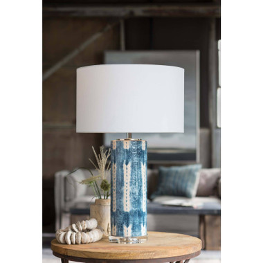 Master artisans produce a fresh and modern take on the classic blue and white look of the Mali ceramic table lamp. The crystal base serves as an elegant platform for the lamp's dramatic scale and shibori-inspired finish. A natural linen shade, rounded and rolled by hand, is topped with a round polished nickel-finished finial.
Height: 28
Width: 17
Depth: 17
Shade Dims: 17 x 17 x 10
Wattage: 3-Way 150 Watt Max
Bulb Qty: 1
Bulb Type: A Type Medium Base (E26)
Socket: E26 3-Way Cast Turn Knob
Wiring Type: Standard
Cord: 8 feet
Material: Ceramic
Finish: Indigo