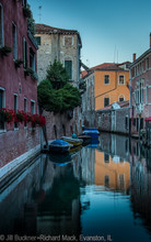 Wall & Flowers on canal. Images from Venice, Italy by  Jill Buckner and Richard Mack. Part of the Two Photographers | One Vision project.