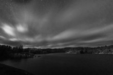 The clouds and stars over George Lake in Kilarney Provincial Park, Ontario. A  cloudy and windy day for a hike. Part of the documentary The Sweetwater Seas / Great Lakes Collection. Fine art print on archival paper ready for framing or on an archival canvas wrap printed to the exacting standards of the artist.