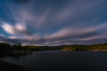 The clouds and stars over George Lake in Kilarney Provincial Park, Ontario. A cloudy and windy day for a hike. Part of the documentary The Sweetwater Seas / Great Lakes Collection. Fine art print on archival paper ready for framing or on an archival canvas wrap printed to the exacting standards of the artist.