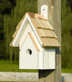 Brand new wooden bird house hand crafted with cypress wood construction featuring a copper trimmed and shingled roof with each shingle hand cut and stone washed.  Hand painted in a whitewashed finish with light distressing.