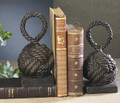Nautical knot bookends intricately cast of iron and finished with a rich bronze patina. 