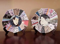 Pair of Geisha and Samurai decorative plates. Crafted of porcelain and masterfully hand painted, these plates feature sophisticated asymmetrical edges. Can be displayed on wood stands or wall mounted.