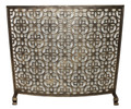 Brand new curved fireplace screen showcasing an elaborate motif of interlocking stylized floral arabesques.  Artfully designed and hand crafted of iron with a rich burnished gold finish and protective wire mesh.