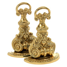 Brand new bookends artfully designed to resemble vintage andirons.  Intricately cast of solid brass and finished with a polished brass patina.