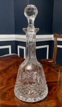 cut crystal decanter presenting a design reminiscent of the Waterford Lismore pattern.