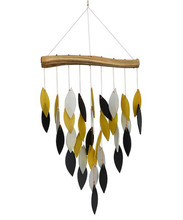 Waterfall wind chime presenting a cascade of gold, black and grey hand cut, sandblasted glass chimes suspended from a driftwood canopy.