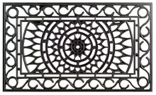 Rubber doormat showcasing an elaborate iron gate design with a central sunburst motif.  