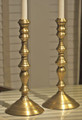 Brand new pair of colonial style candle holders. Intricately cast of brass with a rich antique brass patina.