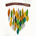 Waterfall wind chime presenting a cascade of colorful hand cut, sandblasted glass chimes suspended from a natural wood canopy.