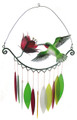 Wind chime showcasing a hummingbird sipping nectar from a flower.  Colorful hand cut, sandblasted, leaf shaped glass chimes are suspended below and make beautiful music as they jingle in the breeze. 