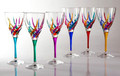 Brand new cut crystal wine glasses crafted in Italy and hand painted by master Venetian artisans.  These wine glasses feature multicolor stems that support bowls hand painted in a rainbow of colors.  Sold as a set of six.