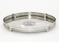 Chippendale style oval serving tray with classical etched design and pierced gallery trim.  Crafted of stainless steel with a gleaming nickel finish. 