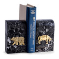 Icons of wall street bookends embellished with antique gold-plated bull and bear emblems.  Crafted of black striated marble with a richly polished finish. 