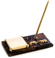 Wall street bull and bear tiger eye striated marble pen and Post It note holder. The marble stand supports a gold-plated brass roller ball pen (included) and Post It note holder.