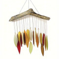 Wind chime showcasing a spectrum of autumnal color, leaf shape, hand cut, sandblasted glass chimes suspended from a natural driftwood canopy.