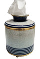 Porcelain tissue dispenser hand painted with a blue stripe motif set against a sophisticated ivory crackle finish accented with decorative brass trim.