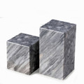 Artfully designed, asymmetrical cube shape, gray marble bookends with beautiful striations and a lustrous polished finish
