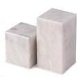 Artfully designed, asymmetrical cube shape, white marble bookends with beautiful striations and a lustrous polished finish