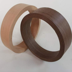 Banjo rims in maple and walnut show coarse turned