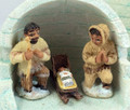 The costumes are a traditional Alaskan parka style, with a sled for Baby Jesus.